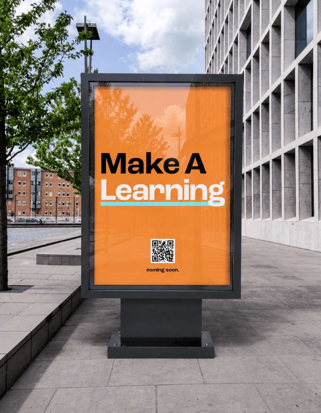 'Make A Learning' poster displayed on a street billboard